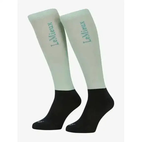 Light green and black lemieux competition socks with subtle upper leg logo perfect for riding and performance use