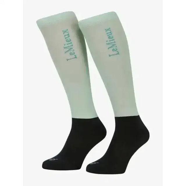 Light green and black lemieux competition socks with subtle upper leg logo perfect for riding and performance use