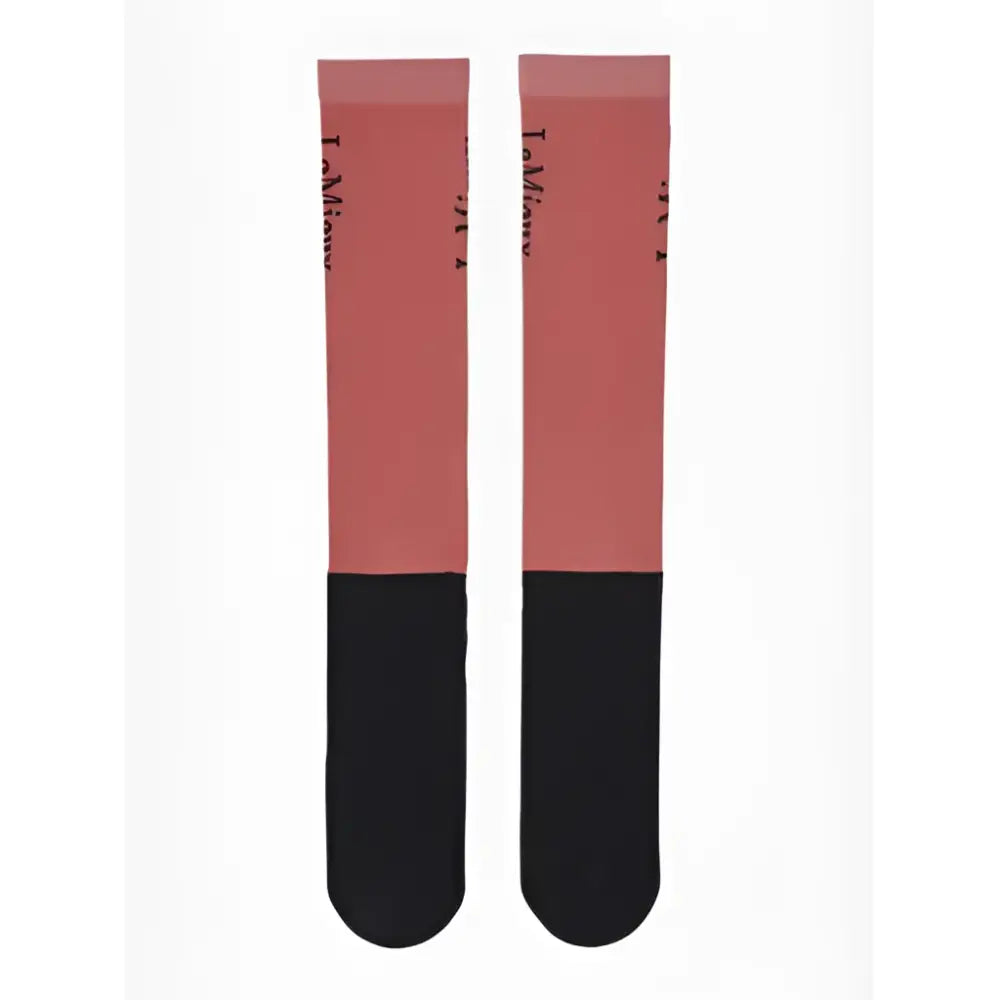 A pair of lemieux competition socks in cranberry coral and black with subtle text pattern on the upper section