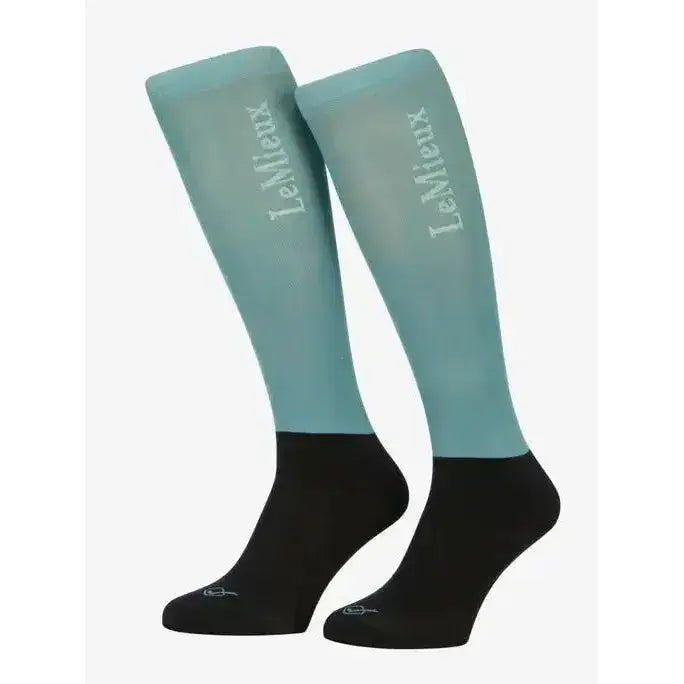 A pair of lemieux competition socks in lagoon teal with black toe and cuff and white logo embroidery on the side