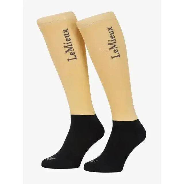 Beige and black two-tone knee-high lemieux competition socks with branding on the upper leg perfect for competition use