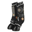 Black horse leg protection with silver and gold accents and adjustable straps from lemieux conductive magno boots