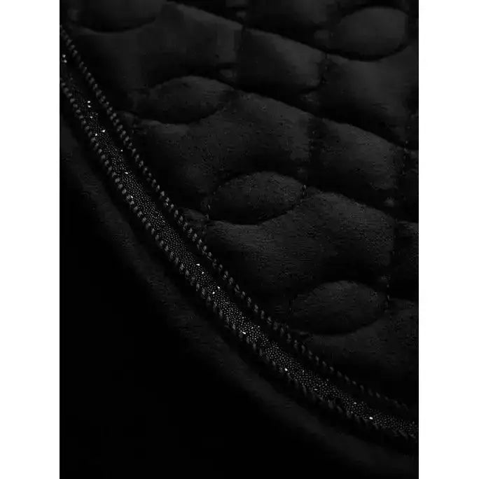 Black quilted lemieux crystal suede close fabric with padded texture and zipper with metallic studs for forward-cut jumping saddles