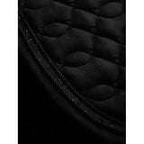 Black quilted lemieux crystal suede close fabric with padded texture and zipper with metallic studs for forward-cut jumping saddles