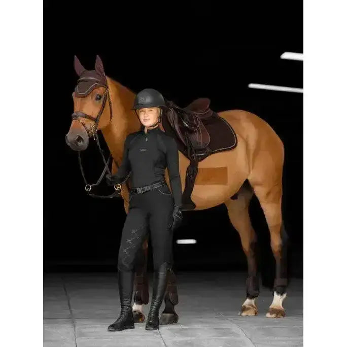 Black lemieux crystal suede close riding outfit with subtle diamond-patterned leggings perfect for forward-cut jumping saddles