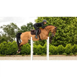 A chestnut horse jumping wearing a lemieux crystal suede close contact square saddle in brown forward-cut style