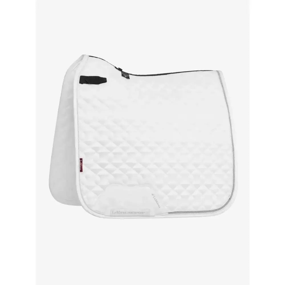 White quilted lemieux crystal suede dressage saddle pad with black zipper and leather girth protection trim