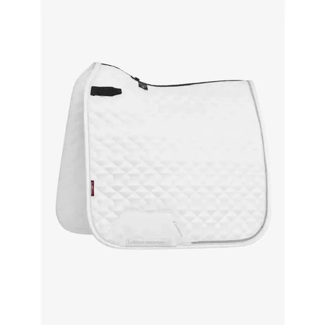 White quilted lemieux crystal suede dressage saddle pad with black zipper and leather girth protection trim