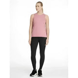 A soft pink sleeveless athletic top with a subtle logo paired with lemieux dani sport legging black made from lightweight fabric
