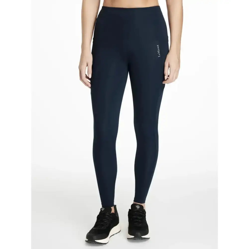 Navy blue high waisted lemieux dani sport legging with subtle side seam logo perfect for activewear