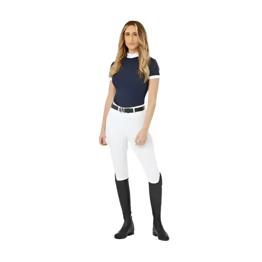 Navy blue lemieux demi pull short-sleeved equestrian top with white trim and high collar paired with breggings white full-seat silicone grip