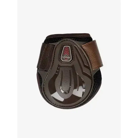 Black and brown lemieux derby projump fetlock boot with glossy plastic shell and leather strap for equestrian use