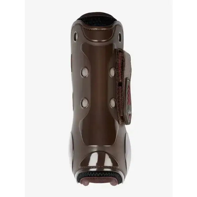 Brown glossy lemieux derby projump tendon boot with black padded interior and adjustable strap for support