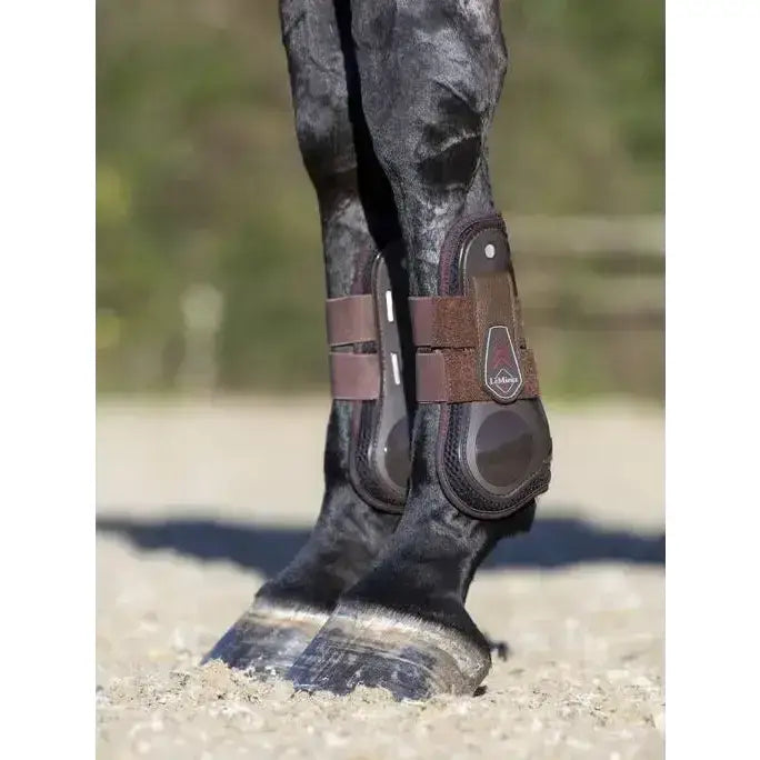 Brown leather lemieux derby projump tendon boot with black padding and adjustable straps for horse leg protection