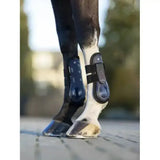 Black and blue lemieux derby projump tendon boot with adjustable straps for optimal horse leg protection