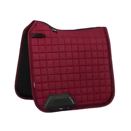 Burgundy lemieux diamante dressage pad with quilted texture black trim and branded logo patch for riding use