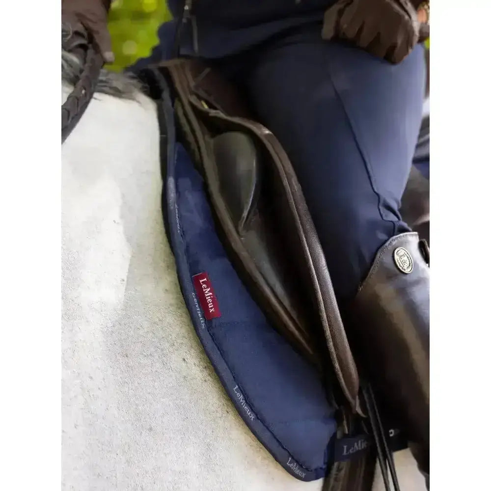 Navy blue lemieux dressage work pad with brown leather trim and red brand label perfect for work pad controls