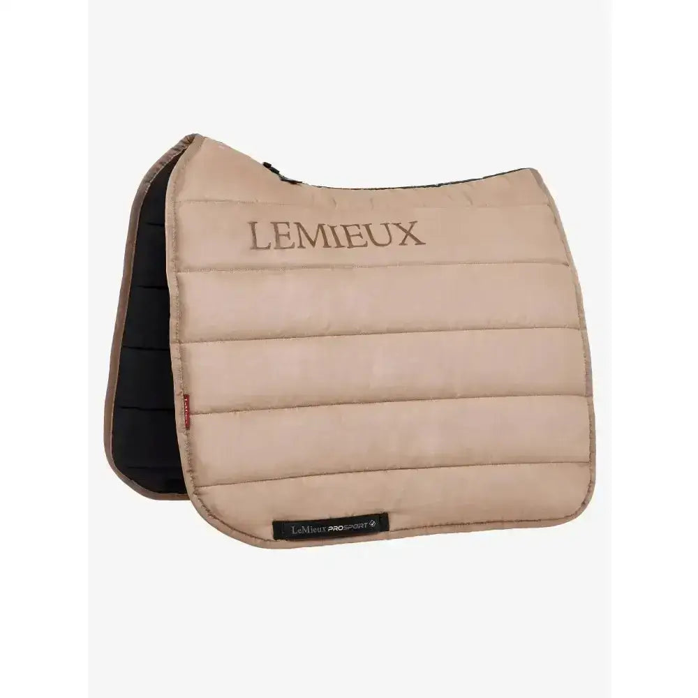Beige quilted lemieux dressage work pad with black underside featuring lemieux branding and work pad controls