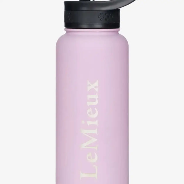 A matte pink lemieux drinks bottle fondant made of stainless steel with a black flip-top lid for easy drinking