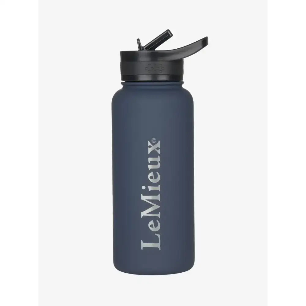 A matte navy blue lemieux drinks bottle with a black flip-top lid designed to keep drinks cold