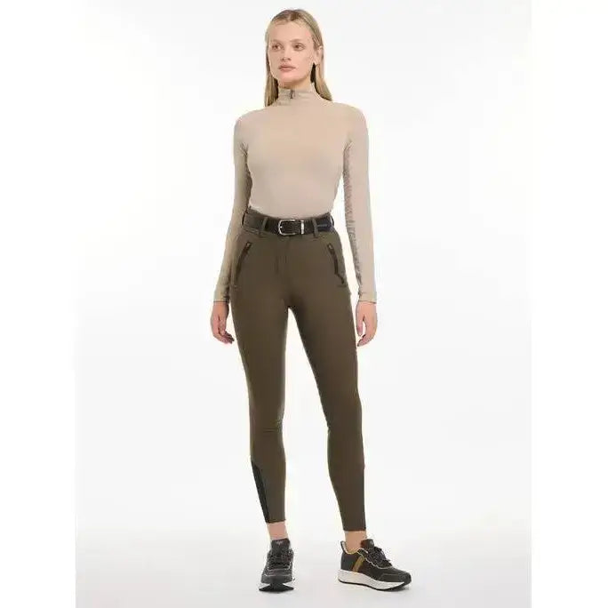 Olive green lemieux drytex waterproof breeches with black zipper pockets and matching belt for seat alpine riding