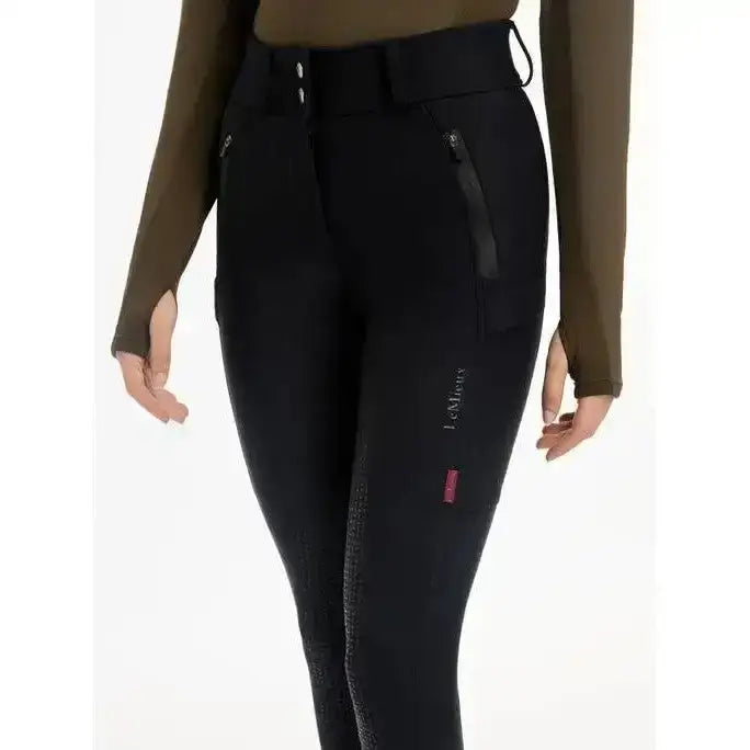 Black lemieux drytex waterproof breeches with subtle lower leg texture and pink brand tag ideal for all-weather riding
