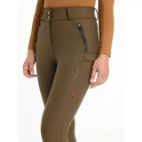 Olive green lemieux drytex waterproof breeches with high waist zippered pockets and knee grip alpine branding on thigh