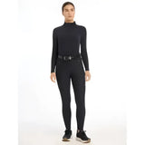 Black lemieux drytex waterproof breeches knee grip navy with high neck long sleeves and subtle side pockets paired with black shoes