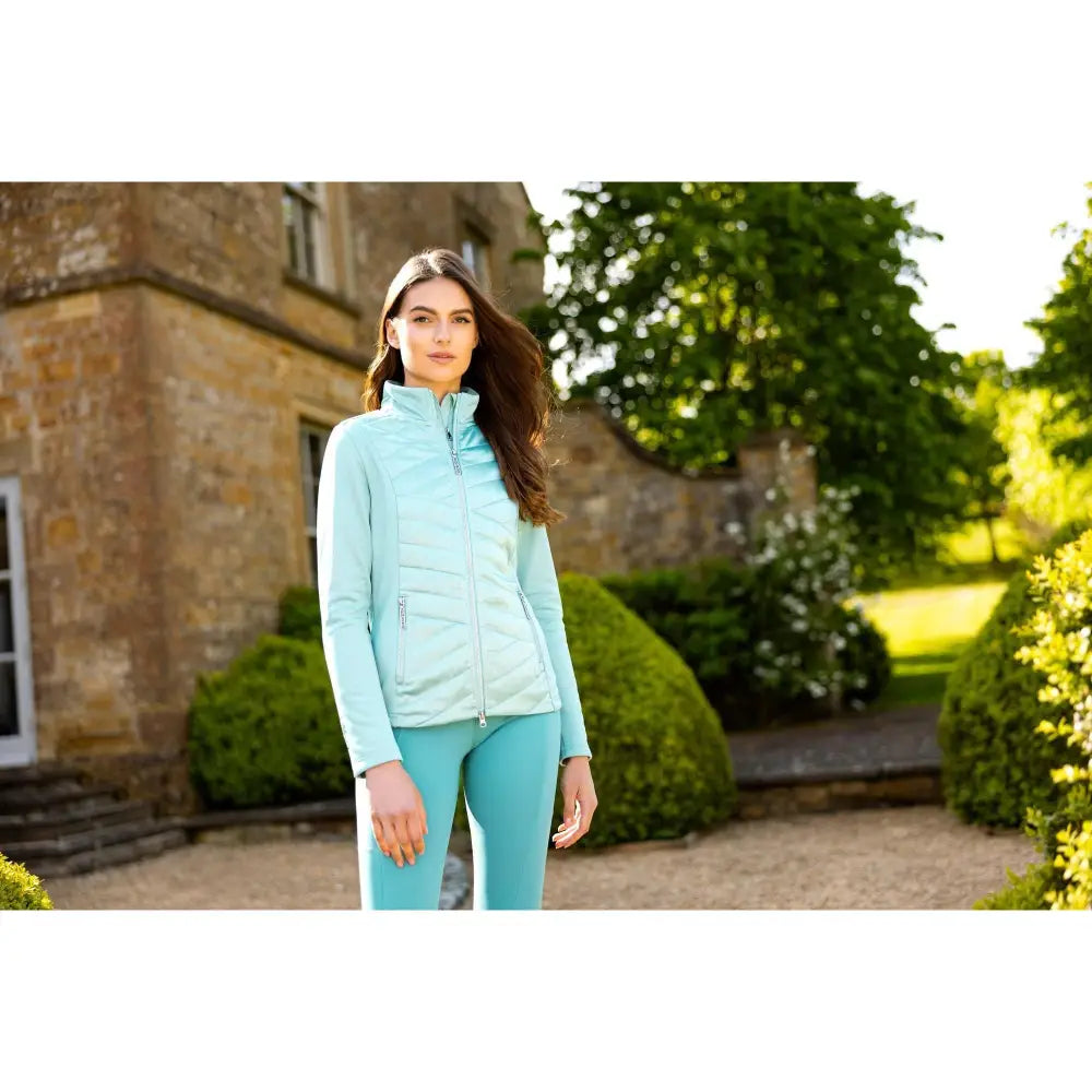 Light blue quilted lemieux dynamique jacket with zip up front shown with matching leggings in dynamique jacket aqua color