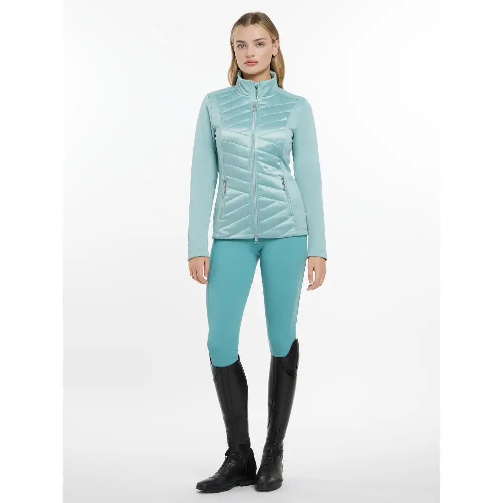 A light teal quilted lemieux dynamique jacket aqua with high collar and diagonal stitching for casual wear