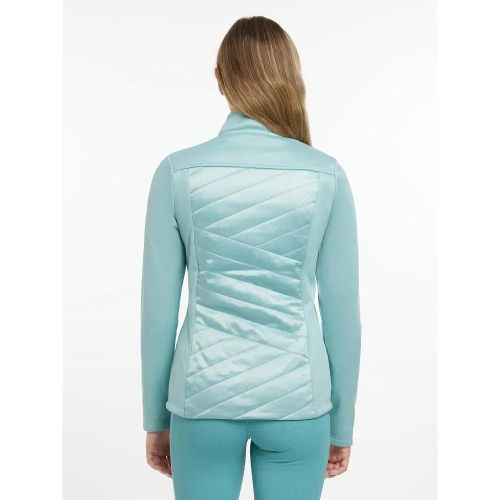 A light teal quilted lemieux dynamique jacket with high collar and diagonal stitching pattern for cool weather