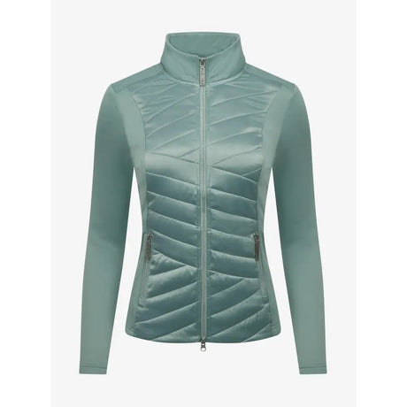 A sleek light teal quilted lemieux dynamique jacket with high collar and zippered side pockets for cold weather