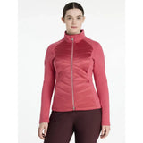 A women’s pink quilted lemieux dynamique jacket with a high collar and zip-up front in dynamic jacket cranberry