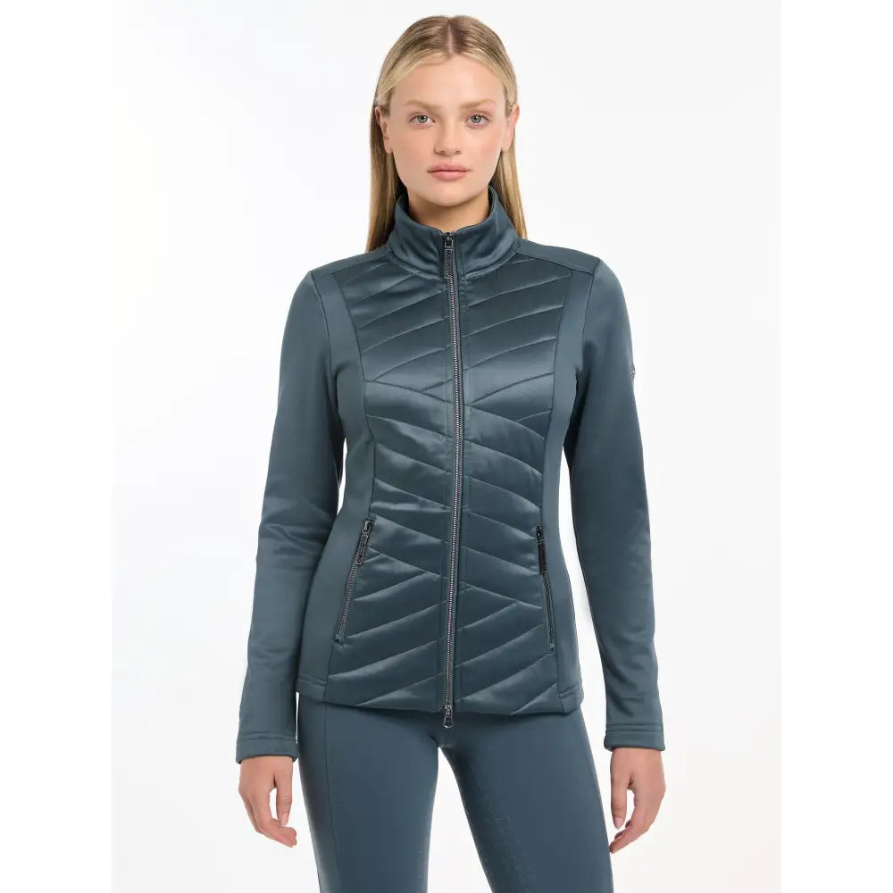 Teal Lemieux Dynamique Jacket Petrol with high collar worn by stylish woman