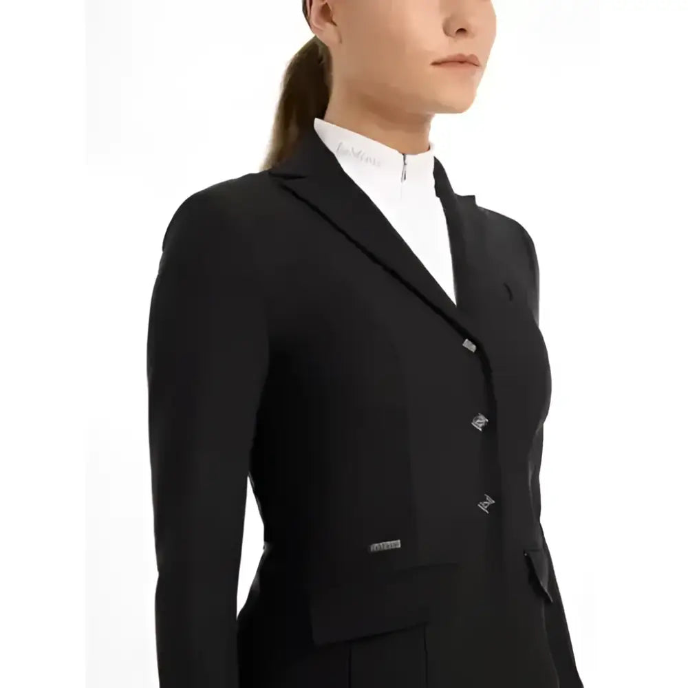 Black tailored lemieux dynamiqué show jacket with silver buttons and brand logo offering ultimate breathability for competition performance