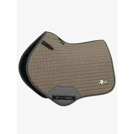 Tan quilted lemieux earth close contact square saddle pad with black trim and gray fabric patch at the front
