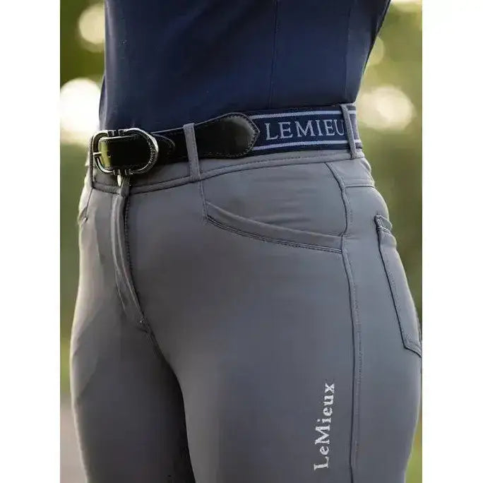 Gray equestrian riding pants with a black lemieux elasticated belt navy featuring white lemieux branding