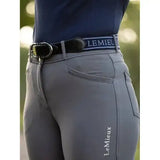 Gray equestrian riding pants with a black lemieux elasticated belt navy featuring white lemieux branding