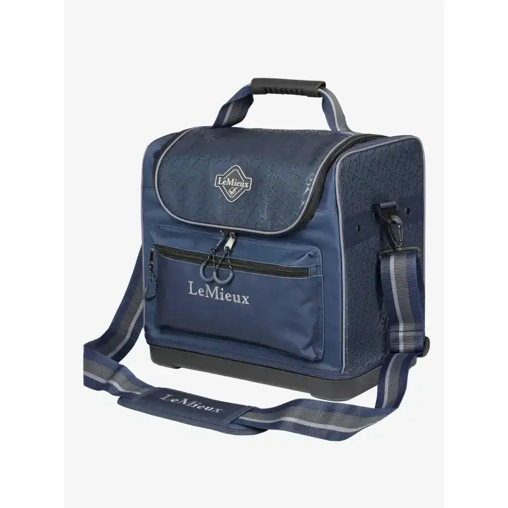 Navy blue lemieux elite pro grooming bag with textured fabric black zippers and shoulder strap for grooming essentials
