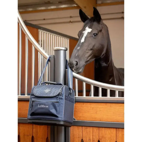 Navy blue lemieux elite pro grooming bag with silver embroidery and front zippered pocket for grooming essentials