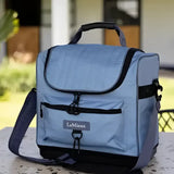Light blue quilted insulated lemieux elite pro grooming bag powder blue with black trim and shoulder strap for grooming essentials