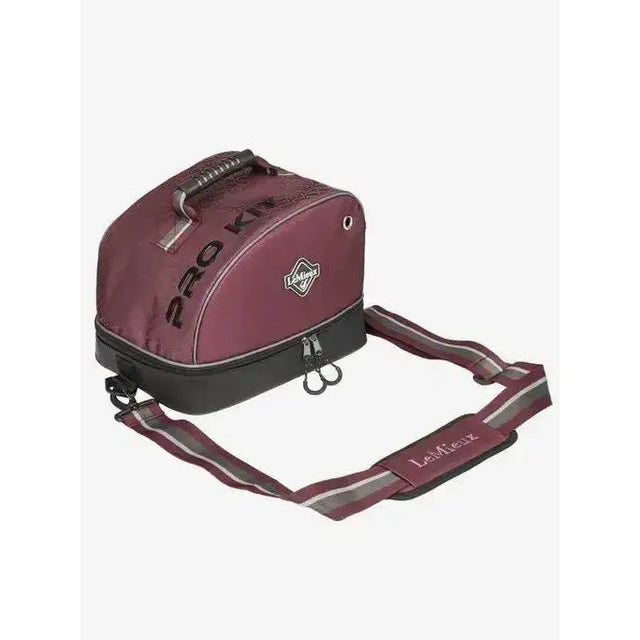 Back view of maroon and black lemieux elite pro hat box saddlebag with reflective stripes on strap for easy visibility