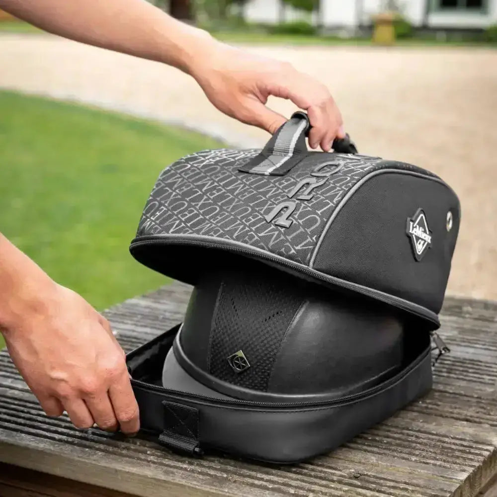 Black lemieux elite pro riding hat bag with gray patterned top and diamond-shaped brand logo for helmet storage