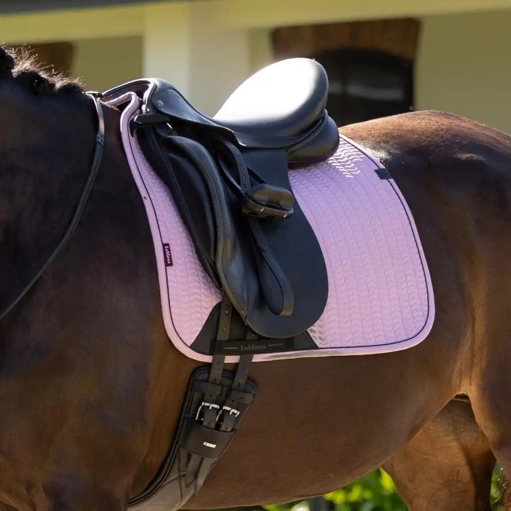 Pink lemieux essence dressage square fondant saddle pad with quilted design black leather straps and subtle logo