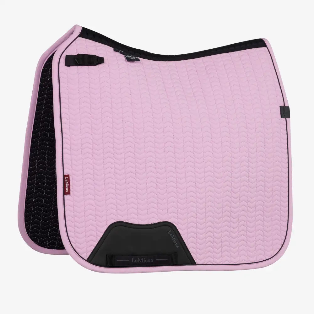 Pink quilted lemieux essence dressage saddle pad with black trim textured pattern with dressage square fondant look