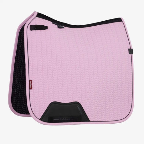 Pink quilted lemieux essence dressage saddle pad with black trim textured pattern with dressage square fondant look