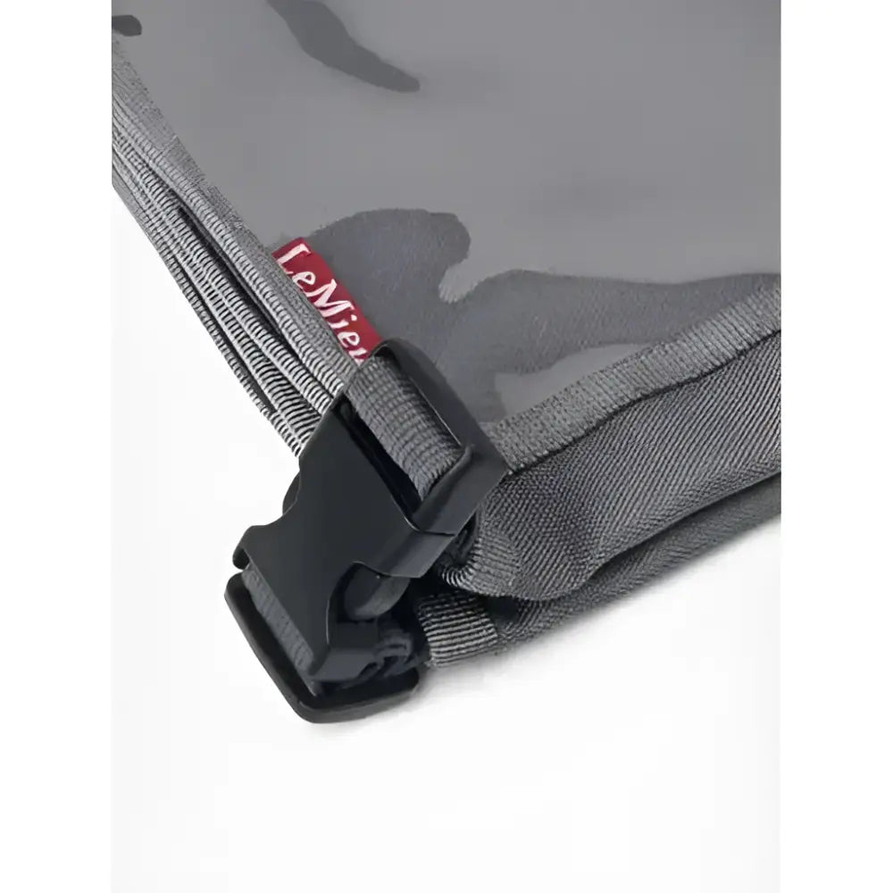 Gray fabric pouch with black buckle and red lemieux tag for lemieux eventing bib slate competition number use