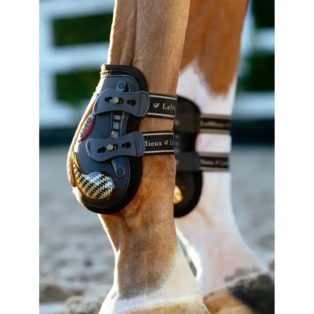 Black and gold lemieux exo-flex® ankle spare strap with herringbone pattern front panel for horse hoof protection