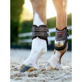 Black and gray lemieux exo-flex® fetlock horse boot with gold patterned front panel expertly designed fusion for performance