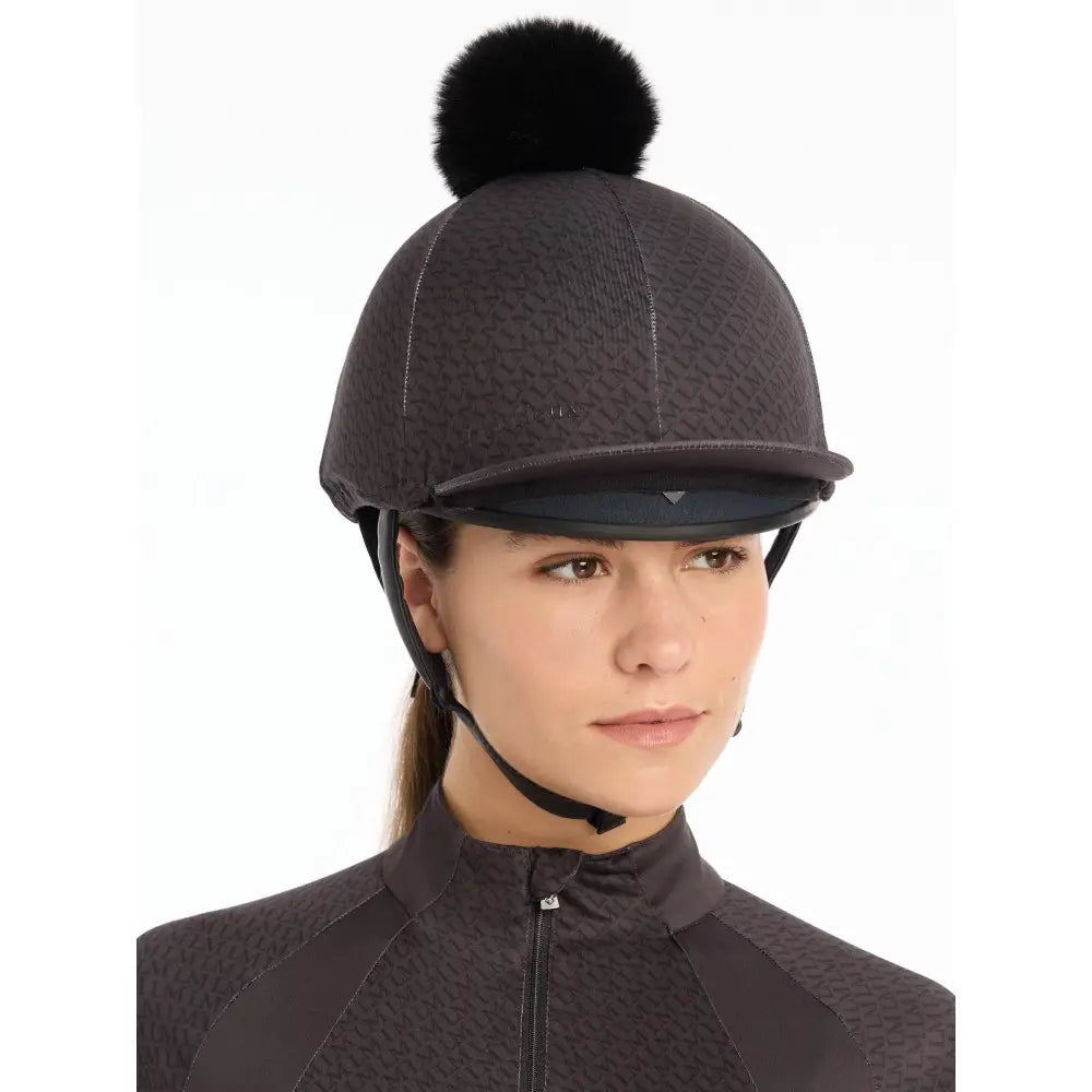 Equestrian riding helmet featuring Lemieux Faith Hat Silk Cinder with black pom-pom